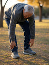 10 Best Flexibility Exercises for Seniors - Old man bent over trying to reach his toes